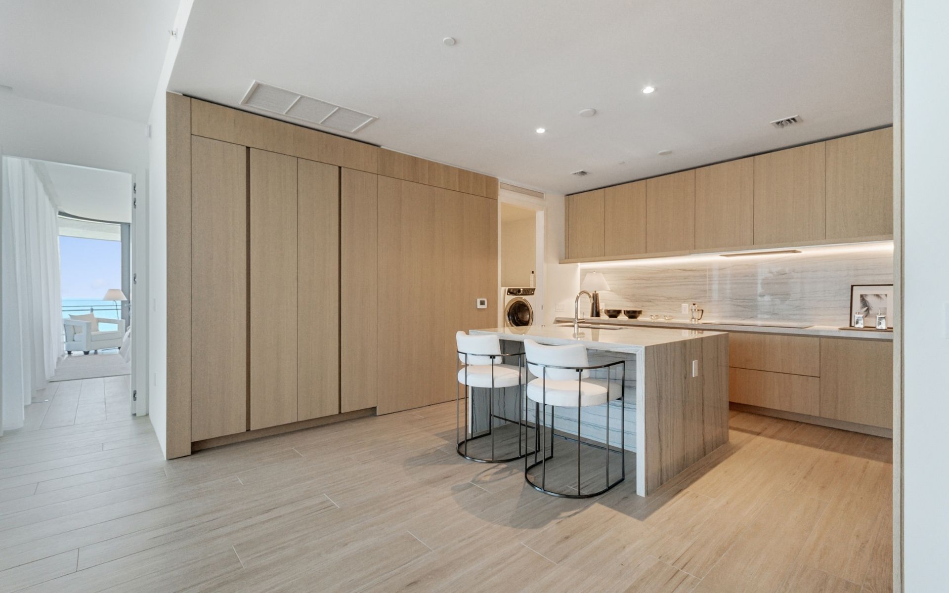 dining room table and kitchen inside 87 park residences