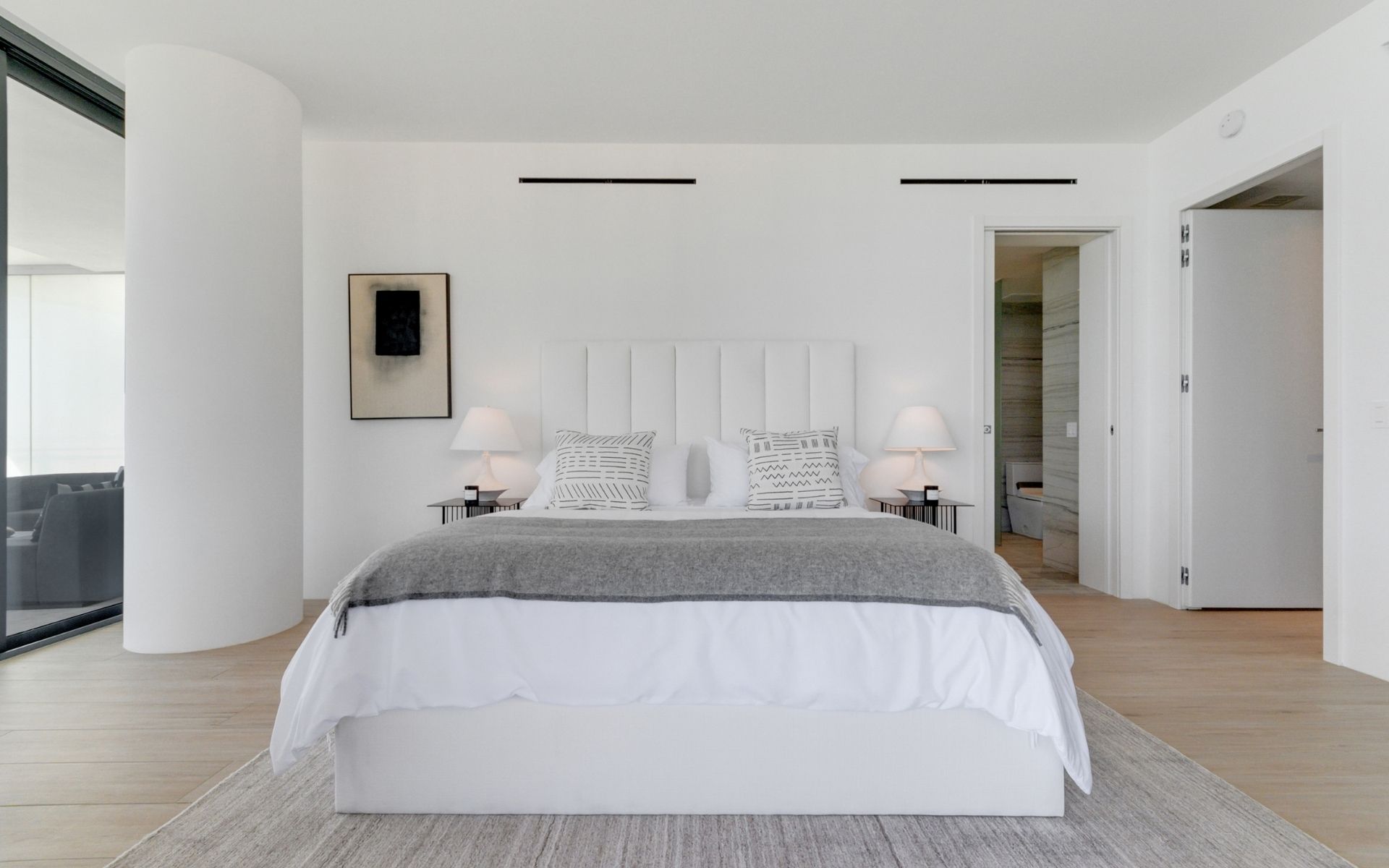 inside master bedroom at 87 park residences featuring large queen bed