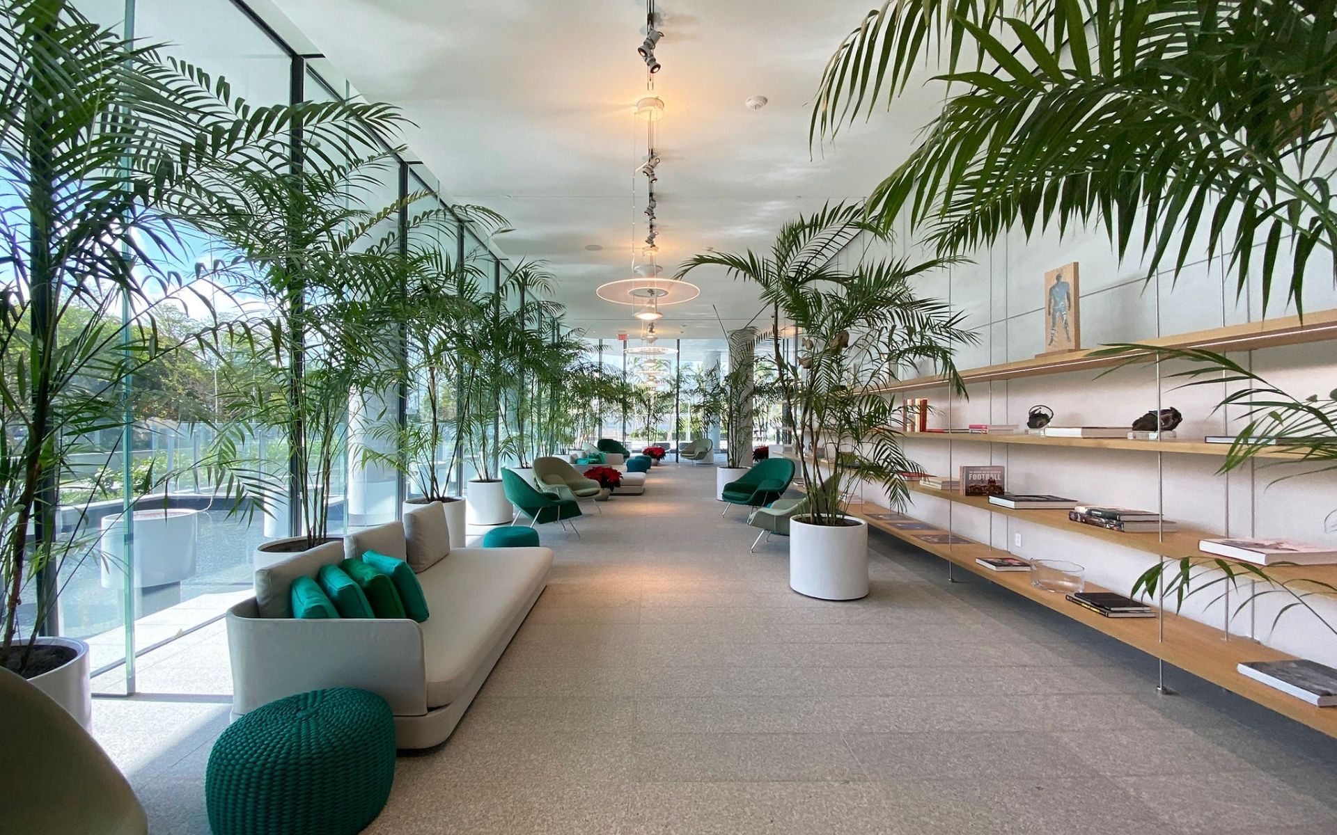 inside lobby at 87 park lines with lush trees and modern furniture