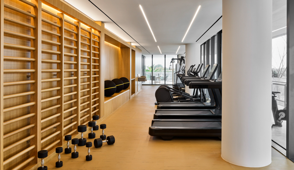 a personal gym inside 87 park residences with treadmills and free weights